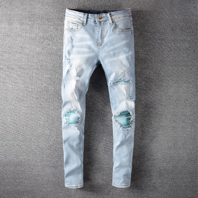 AMIRI Skinny Blue Watercolor Distressed Jeans